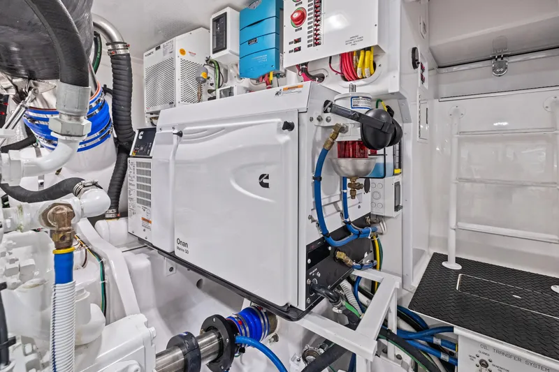Slide: The Image of Engine room of 2025 Viking 64 Convertible yacht, featuring advanced mechanical systems. - 47