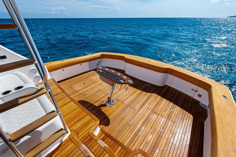 Slide: The Image of Luxurious 2025 Viking 64 Convertible yacht deck with ocean view. - 52