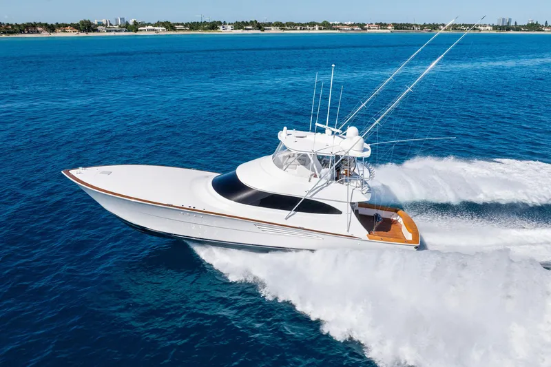 Slide: The Image of 2025 Viking 64 Convertible yacht cruising on open blue ocean waters. - 7